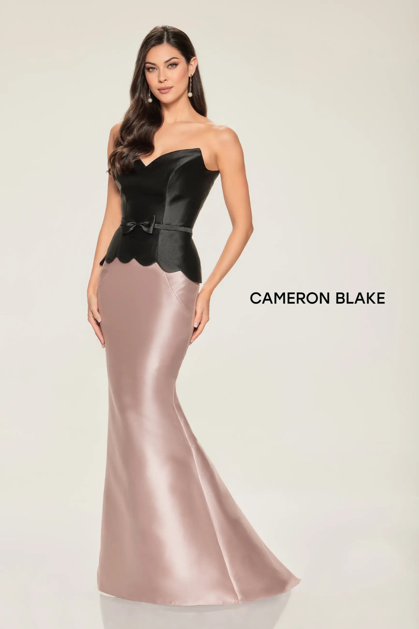 Model wearing a gown by Cameron Blake